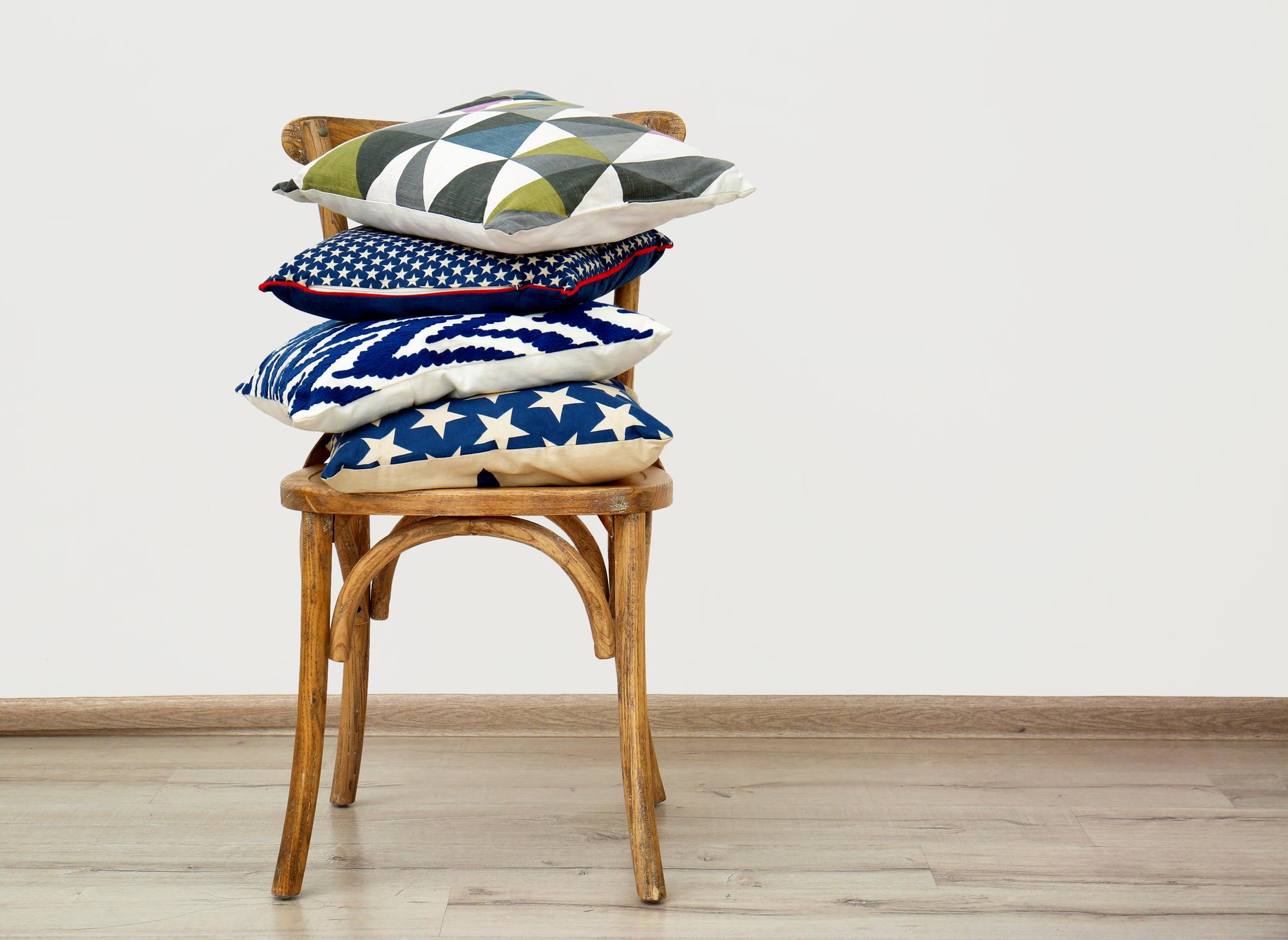pair of embroidered cushions staged in living room